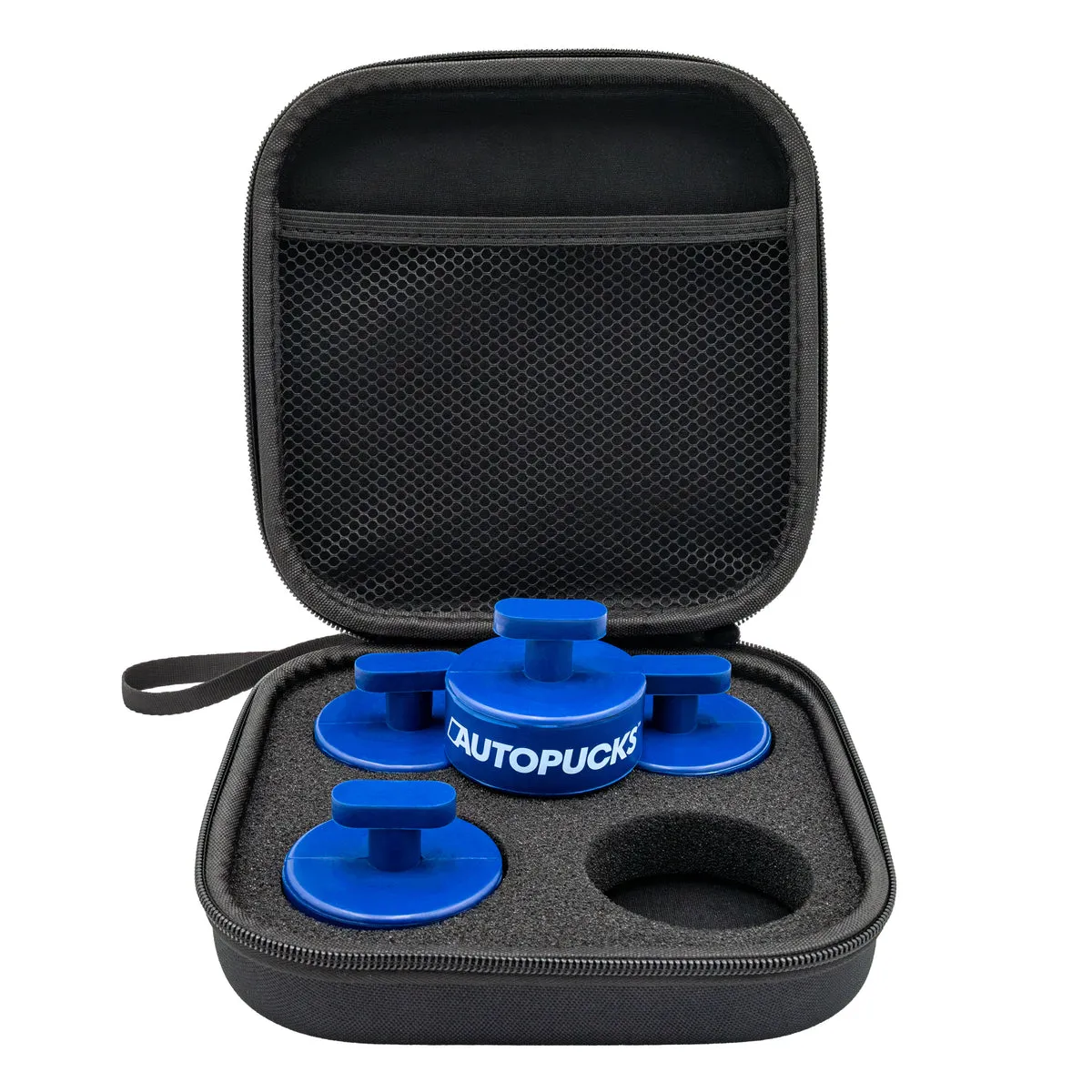 Four blue rubber jack pucks, each with a T-shaped stem on top, sitting in the foam of an open black zip case.